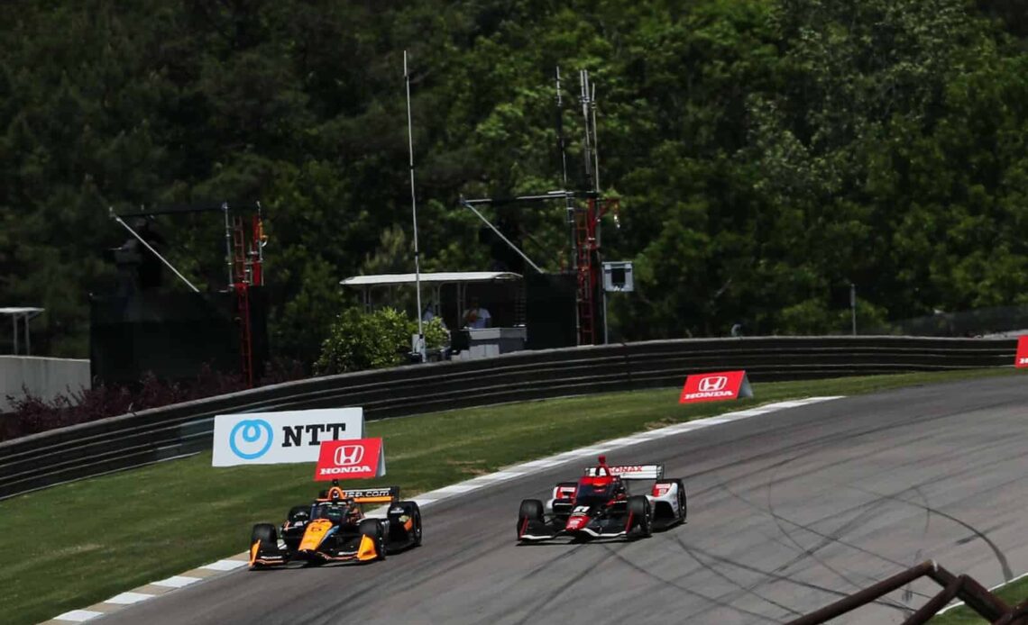 Pato O'Ward makes the race-winning pass on Rinus VeeKay at the IndyCar race at Barber Motorsports Park