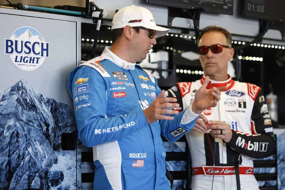 NASCAR Cup Series EchoPark Automotive Grand Prix - Practice AUSTIN, TEXAS - MARCH 24: Kyle Busch, driver of the #8 Netspend Chevrolet, (L) and Kevin Harvick, driver of the #4 Mobil 1 Ford, talk in the garage area during practice for the NASCAR Cup Series EchoPark Automotive Grand Prix at Circuit of The Americas on March 24, 2023 in Austin, Texas. (Chris Graythen/Getty Images)