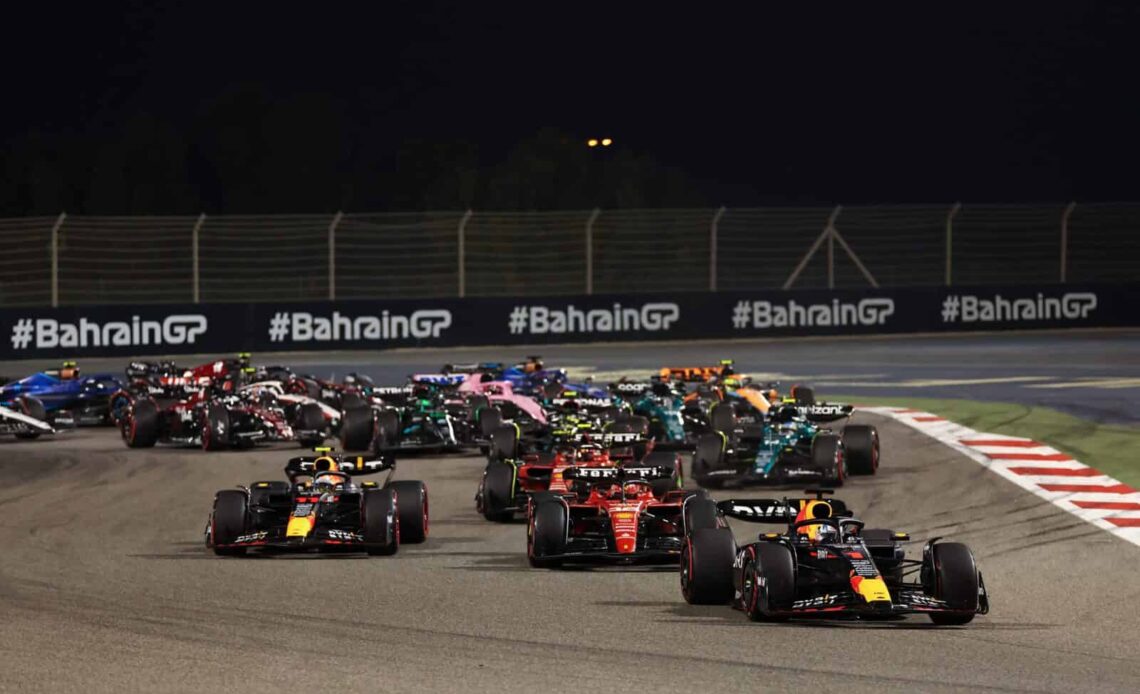 Max Verstappen of the Netherlands driving the (1) Oracle Red Bull Racing RB19 leads Charles Leclerc of Monaco driving the (16) Ferrari SF-23 and the rest of the field at the start during the F1 Grand Prix of Bahrain at Bahrain International Circuit on March 05, 2023 in Bahrain, Bahrain. (Photo by Lars Baron/Getty Images)