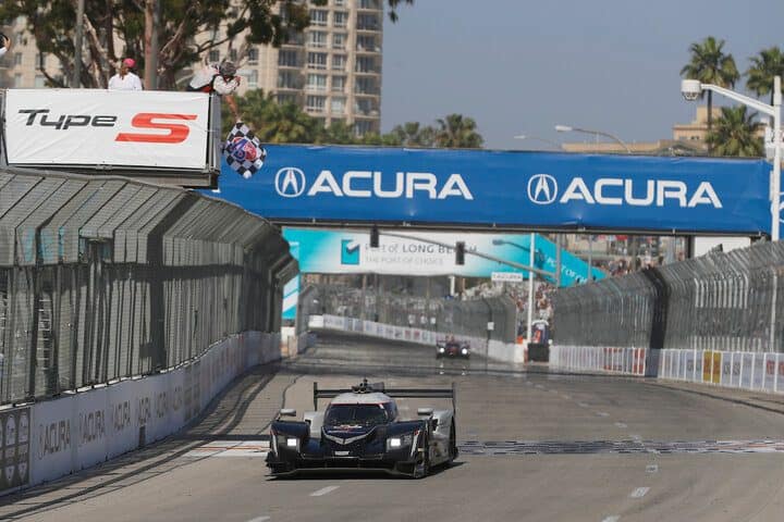 Renger van der Zande takes the checkered flag to win the IMSA Acura Grand Prix of Long Beach, 4/9/2022 (Photo: Courtesy of IMSA)