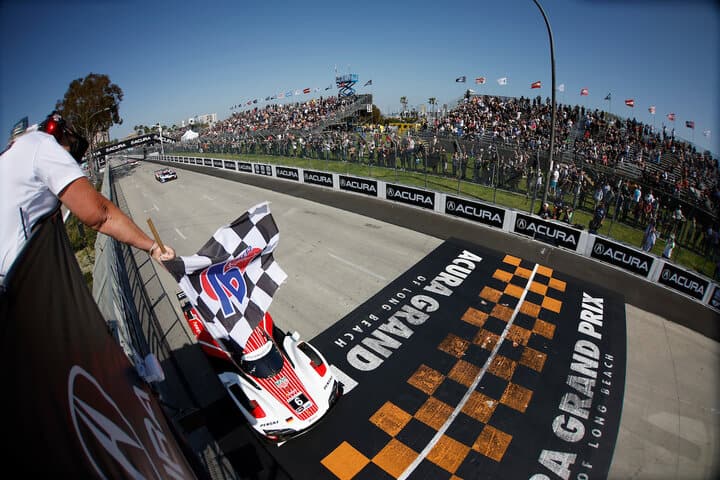 Mathieu Jaminet takes the checkered flag to win the IMSA Acura Grand Prix of Long Beach, 4/15/2023 (Photo: Courtesy of IMSA)