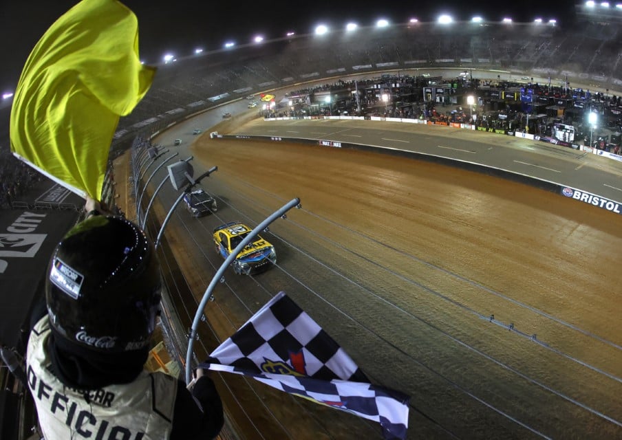 Christopher Bell, driver of the #20 DeWalt Power Stack Toyota, takes the checkered flag under caution to win the NASCAR Cup Series Food City Dirt Race at Bristol Motor Speedway on April 09, 2023 in Bristol, Tennessee. (Photo by James Gilbert/Getty Images)