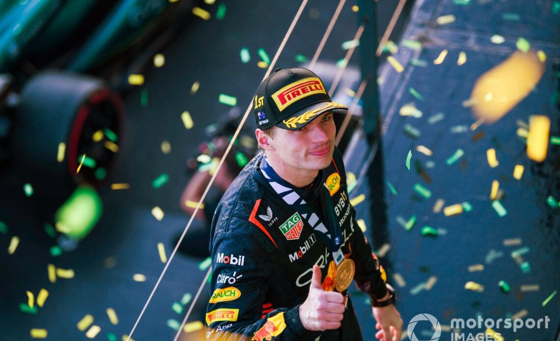 Max Verstappen, Red Bull Racing, 1st position, with his medal on the podium