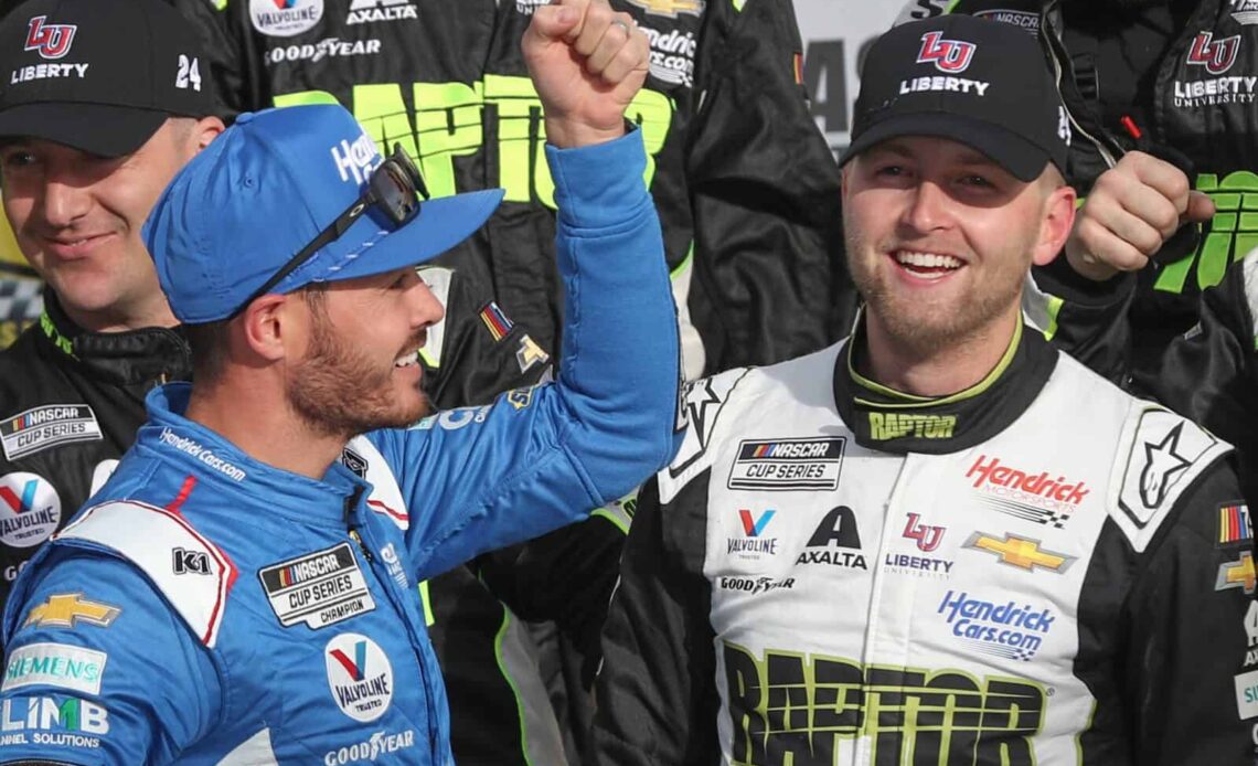 LAS VEGAS, NEVADA - MARCH 05: William Byron, driver of the #24 RaptorTough.com Chevrolet, is congratulated by Kyle Larson, driver of the #5 HendrickCars.com Chevrolet, in victory lane after winning the NASCAR Cup Series Pennzoil 400 at Las Vegas Motor Speedway on March 05, 2023 in Las Vegas, Nevada. (Photo by Meg Oliphant/Getty Images)