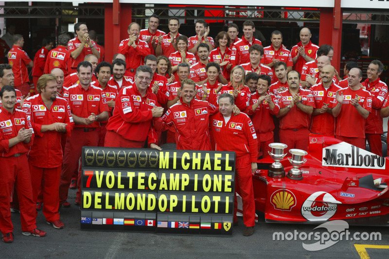 Michael Schumacher, Ferrari F2004 celebrates with the Ferrari team after winning his 7th world championship with Jean Todt and Ross Brawn