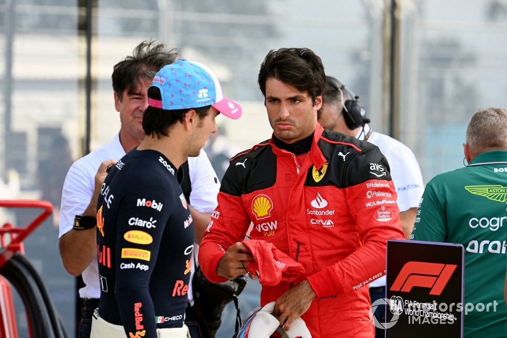 Carlos Sainz, Scuderia Ferrari, pole man Sergio Perez, Red Bull Racing, talk in Parc Ferme