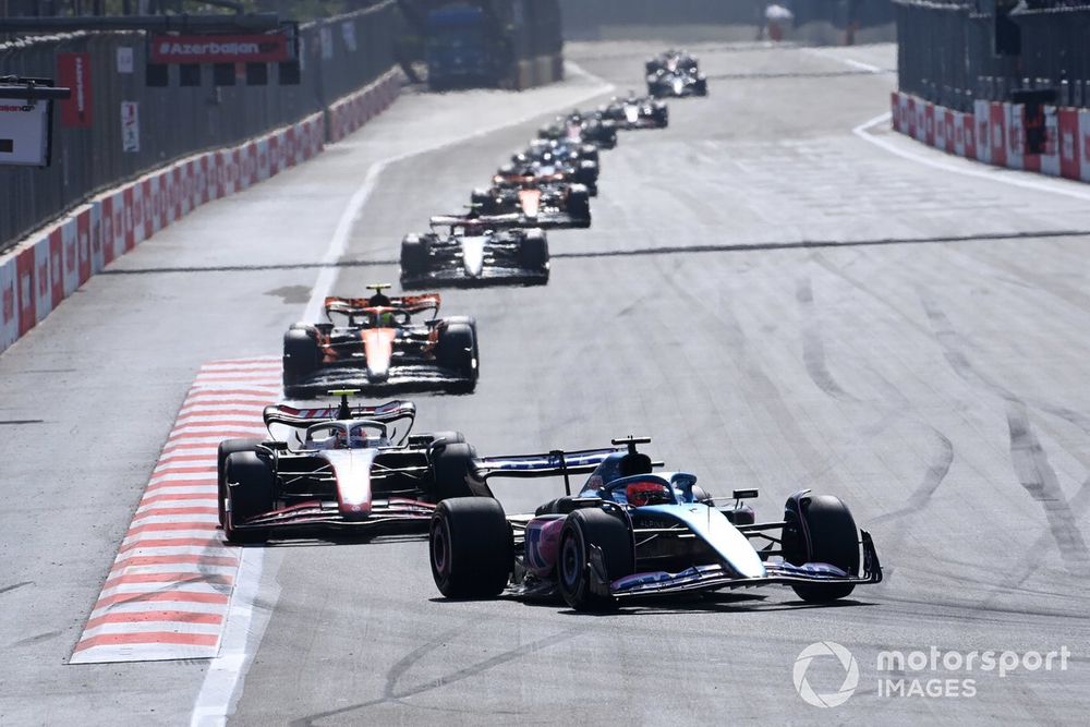 Esteban Ocon, Alpine A523, leads Nico Hulkenberg, Haas VF-23