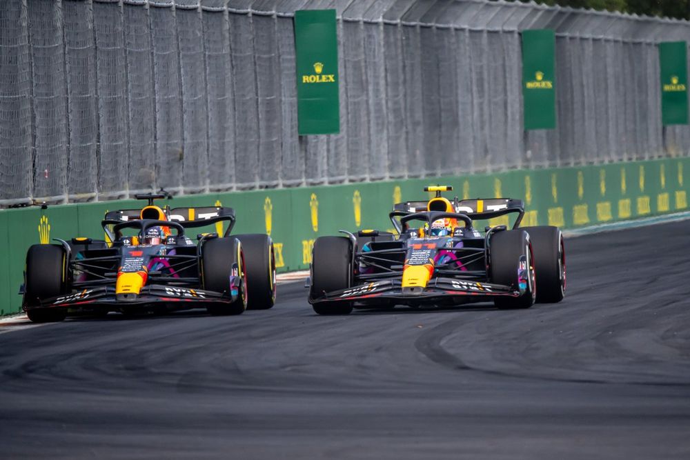 Sergio Perez, Red Bull Racing RB19, battles with Max Verstappen, Red Bull Racing RB19, for the lead of the race