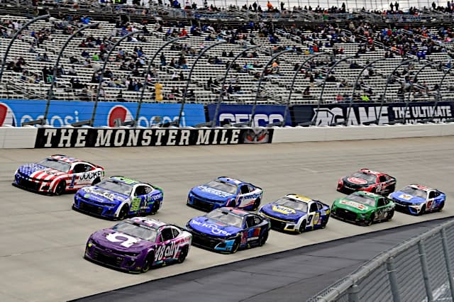 NASCAR Cup Series cars pack racing #48: Josh Berry, Hendrick Motorsports, Ally Chevrolet Camaro, #1: Ross Chastain, Trackhouse Racing, Jockey Chevrolet Camaro and #47: Ricky Stenhouse, Jr, JTG Daugherty Racing, Kroger/Icy Hot Pro Chevrolet Camaro, at Dover Motor Speedway in Wurth 400, NKP