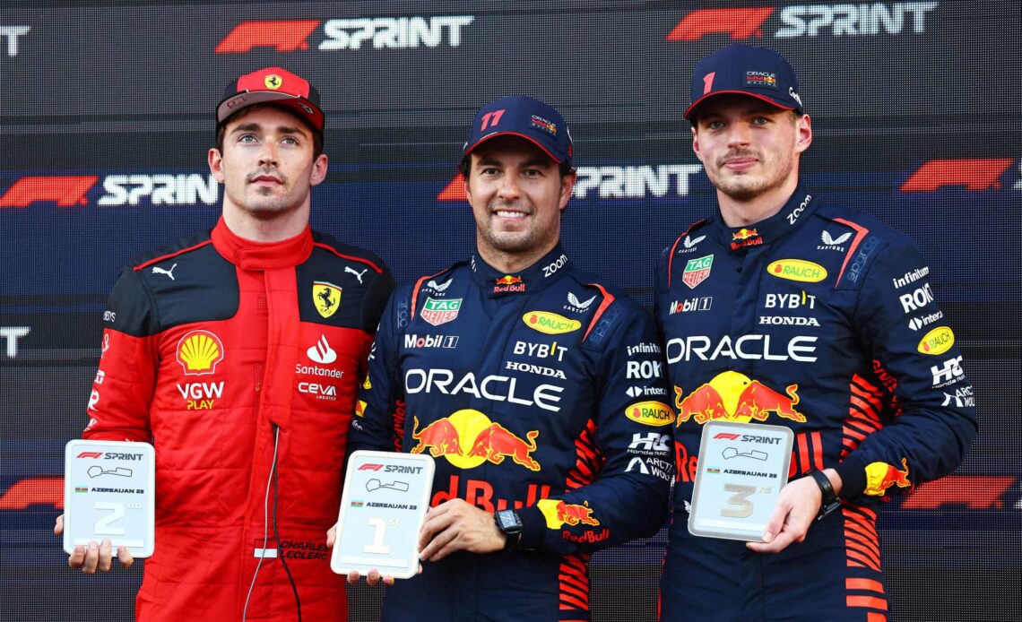 Sprint winner Sergio Perez of Mexico and Oracle Red Bull Racing (C), Second placed Charles Leclerc of Monaco and Ferrari (L) and Third placed Max Verstappen of the Netherlands and Oracle Red Bull Racing (R) pose for a photo in parc ferme during the Sprint ahead of the F1 Grand Prix of Azerbaijan at Baku City Circuit