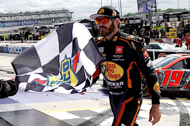 NASCAR Cup Series driver Martin Truex Jr. takes the checkered flag after winning the Wurth 400 at Dover Motor Speedway, NKP