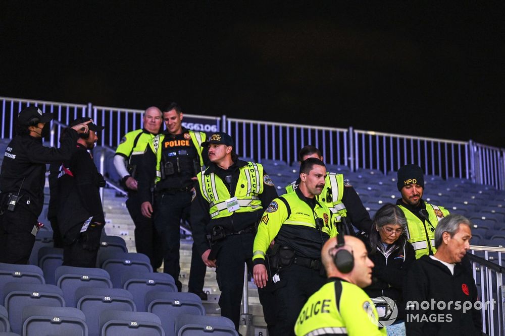 Police eject fans from a grandstand