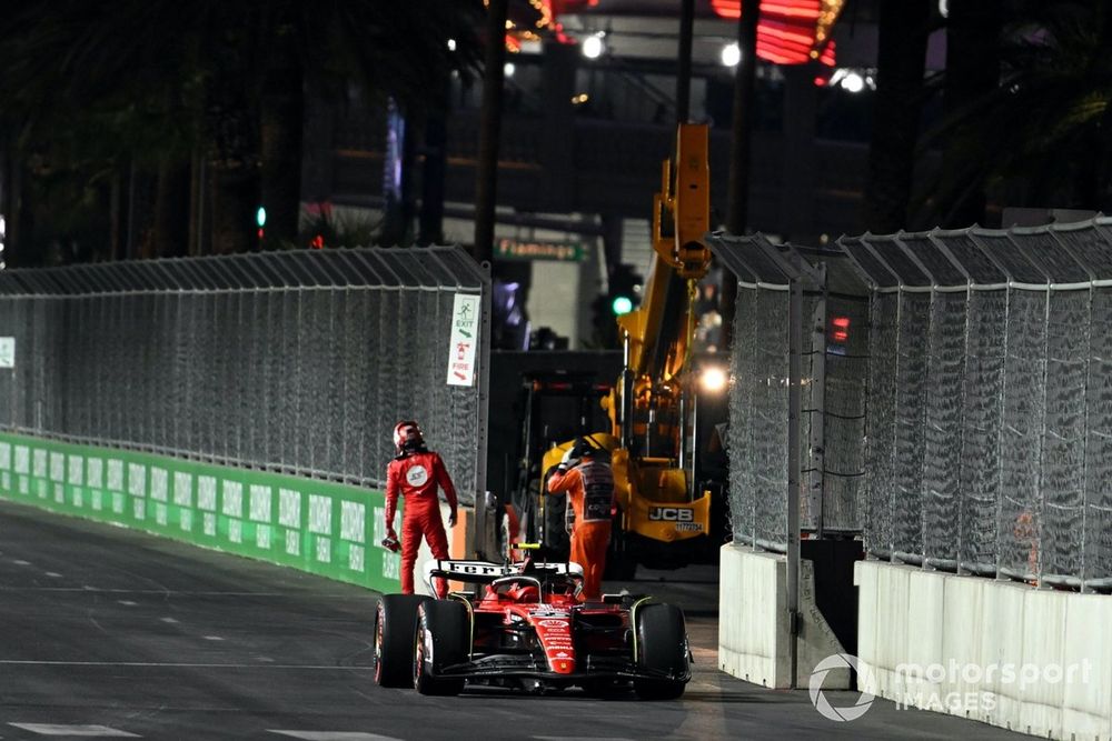 Carlos Sainz, Ferrari SF-23, stops his car on circuit after damage from a manhole cover