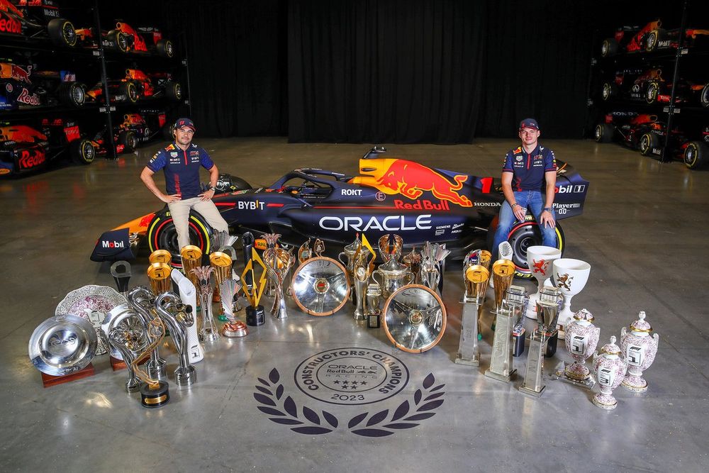 Sergio Pérez, Max Verstappen with the 2023 trophies at Red Bull's Milton Keynes factory