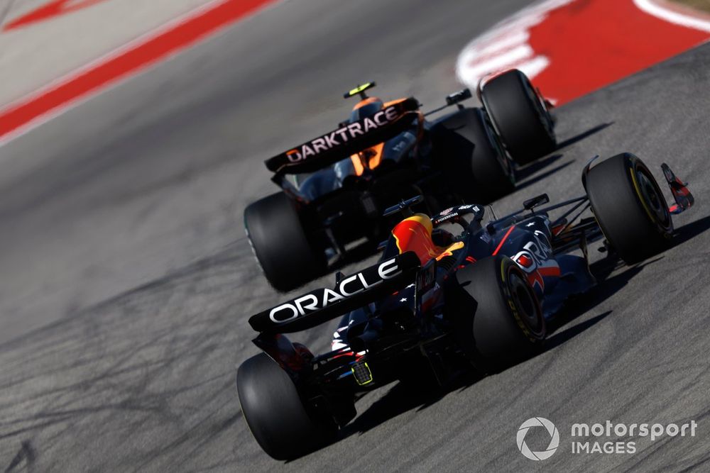 Lando Norris, McLaren MCL60, leads Max Verstappen, Red Bull Racing RB19