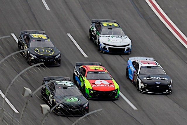 2023 Cup Atlanta II pack racing VII - Tyler Reddick, No. 45 23XI Racing Toyota, William Byron, No. 24 Hendrick Motorsports Chevrolet, and Aric Almirola, No. 10 Stewart-Haas Racing Ford (Credit: NKP)