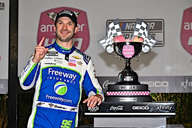 Nascar Cup Series driver Daniel Suarez with the trophy after winning the Ambetter Health 400 at Atlanta Motor Speedway, NKP