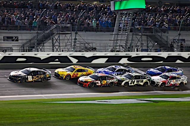 NASCAR Cup Series cars, led by Kyle Busch, racing in the Daytona 500 at Daytona International Speedway, NKP