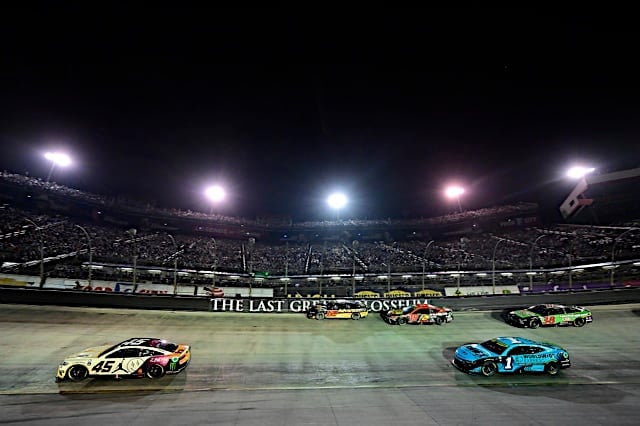 NASCAR Cup Series cars of Tyler Reddick and Ross Chastain pack racing in Bass Pro Shops Night Race at Bristol Motor Speedway, wide view, NKP