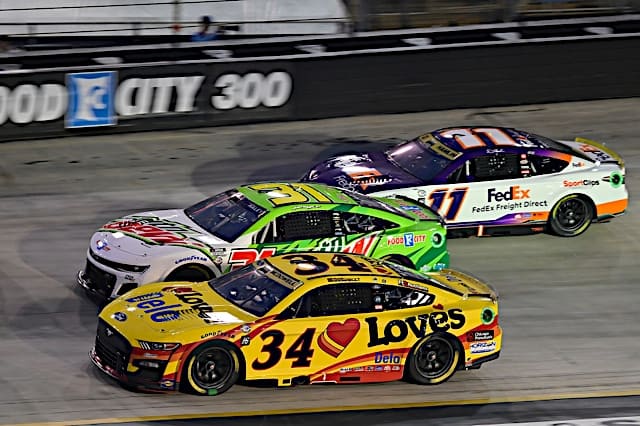 NASCAR Cup Series cars of Michael McDowell, Justin Haley and Denny Hamlin racing in Bass Pro Shops Night Race at Bristol Motor Speedway, NKP