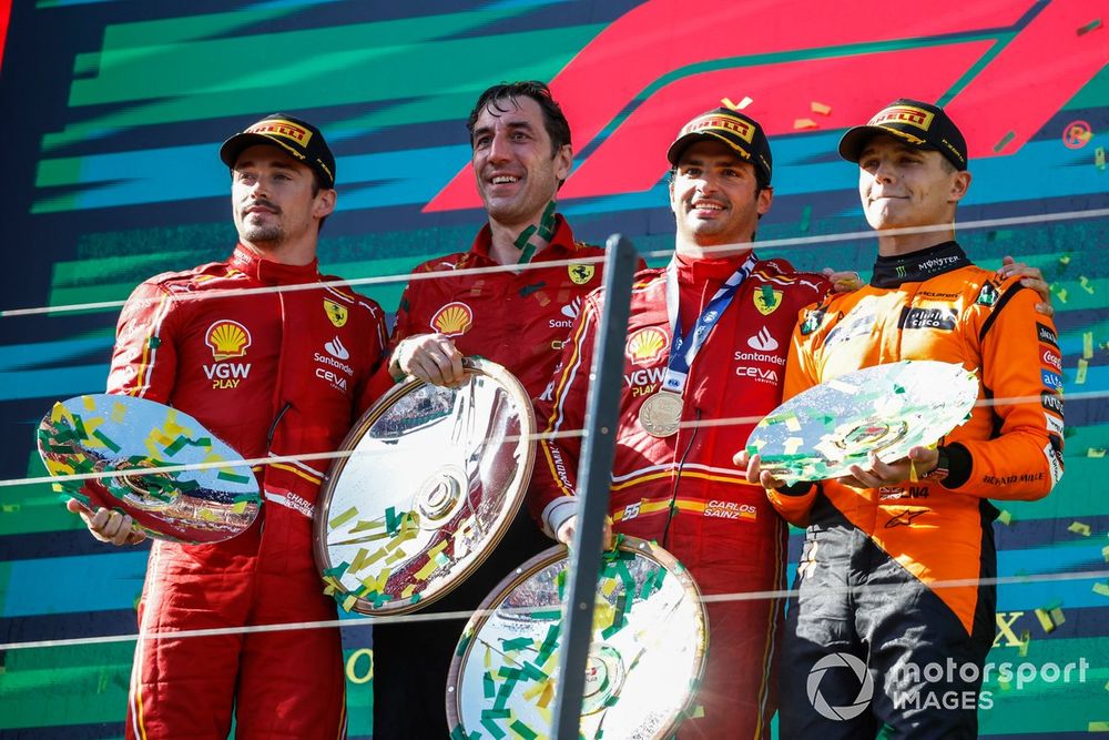 Charles Leclerc, Scuderia Ferrari, 2nd position, the Ferrari trophy delegate, Carlos Sainz, Scuderia Ferrari, 1st position, Lando Norris, McLaren F1 Team, 3rd position, on the podium with their trophies