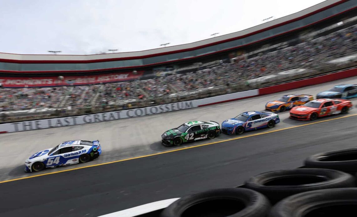 Ty Gibbs, driver of the #54 SiriusXM Toyota, leads the field during the NASCAR Cup Series Food City 500 at Bristol Motor Speedway on March 17, 2024 in Bristol, Tennessee. (Photo by Meg Oliphant/Getty Images)