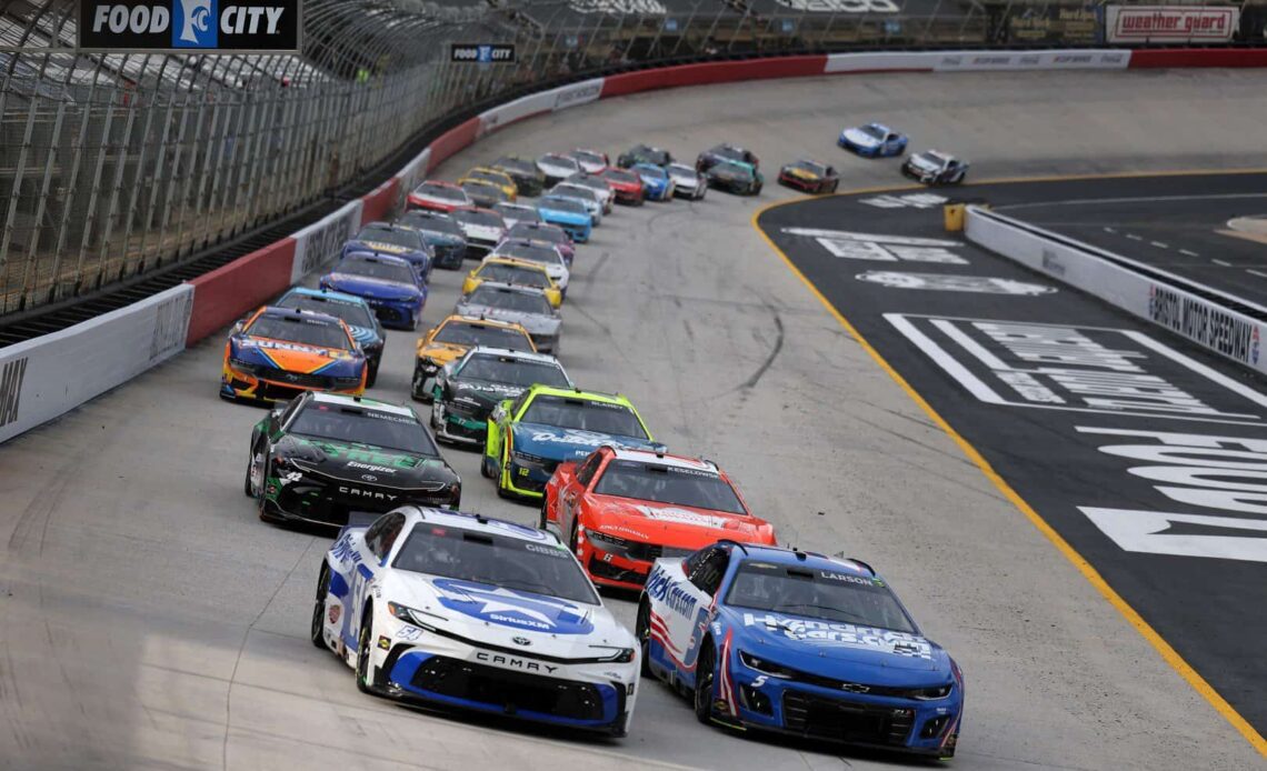 Ty Gibbs, driver of the #54 SiriusXM Toyota, and Kyle Larson, driver of the #5 HendrickCars.com Chevrolet, lead the field during the NASCAR Cup Series Food City 500 at Bristol Motor Speedway on March 17, 2024 in Bristol, Tennessee. (Photo by Jonathan Bachman/Getty Images)