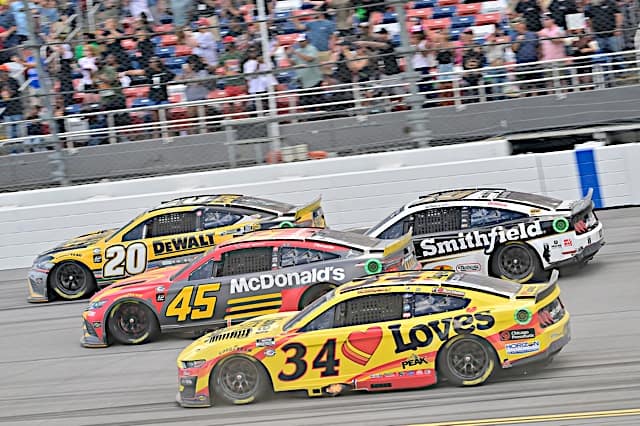 NASCAR Cup Series cars of Christopher Bell, Tyler Reddick and Michael McDowell pack racing at Talladega Superspeedway, NKP