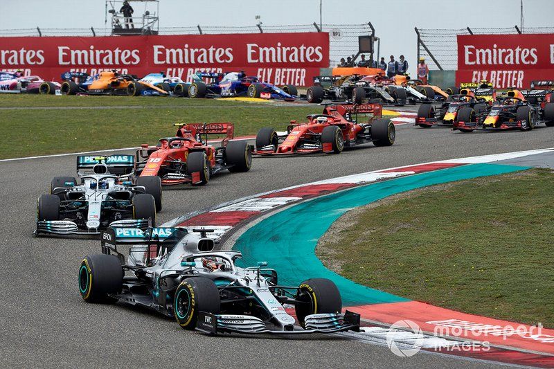 Lewis Hamilton, Mercedes AMG F1 W10, leads on the opening lap of 2019 Chinese GP