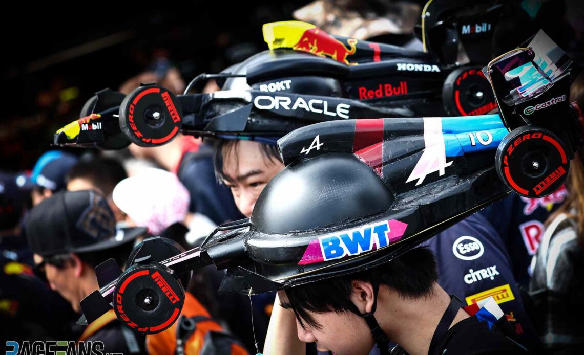 Fans in Alpine and Red Bull hats, Suzuka, 2024