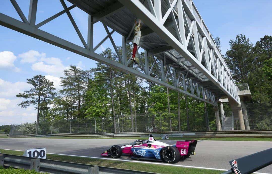 Tom Blomqvist goes underneath Georgina's bridge at the Children's Of Alabama Indy Grand Prix