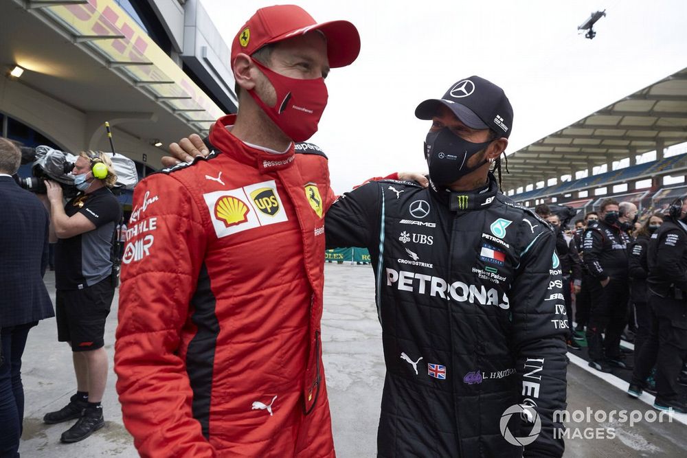 Sebastian Vettel, Ferrari, congratulates Lewis Hamilton, Mercedes-AMG F1, after winning his 7th championship