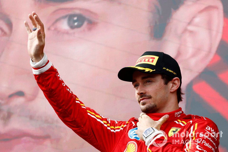 Charles Leclerc, Scuderia Ferrari, 3rd position, waves from the podium