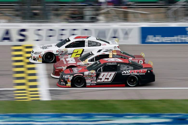 2024 ARCA Kansas I three-wide racing - Andres Perez de Lara, No. 2 Rev Racing Chevrolet, and Fast Track Racing teammates Ryan Roulette, No. 12 Ford, and Michael Maples, No. 99 Chevrolet (Credit: Ed Zurga/ARCA Racing used with permission)