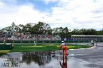 Marshals sweep standing water, Circuit Gilles Villeneuve, 2024