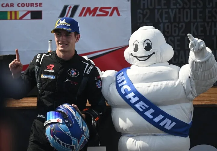 Jagger Jones with Bibendium, "The Michelin Man," after winning IMSA VP Racing SportsCar Challenge Race No. 2 at Mid-Ohio, 6/9/2024 (Photo: Phil Allaway)