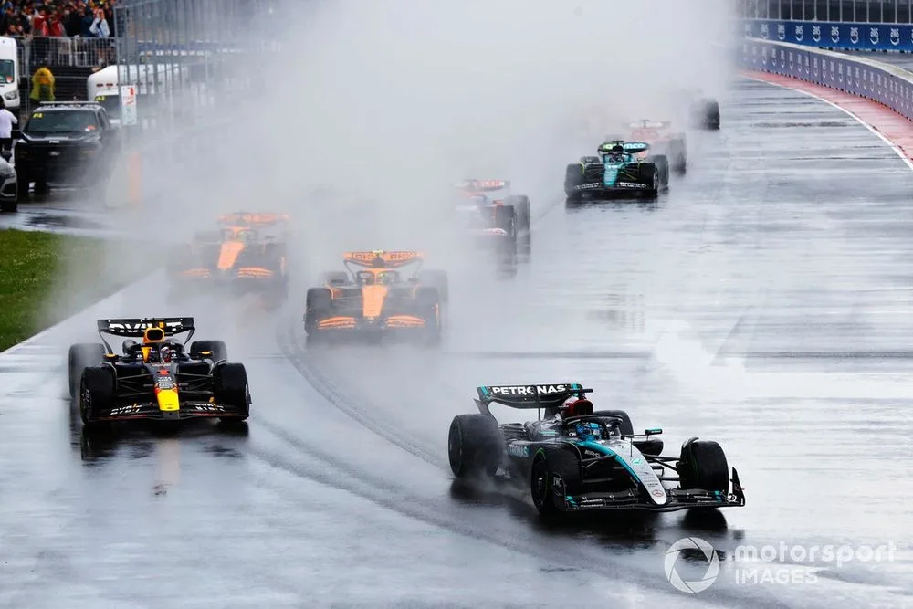 Verstappen victorious over Norris and Russell in weather-affected thriller