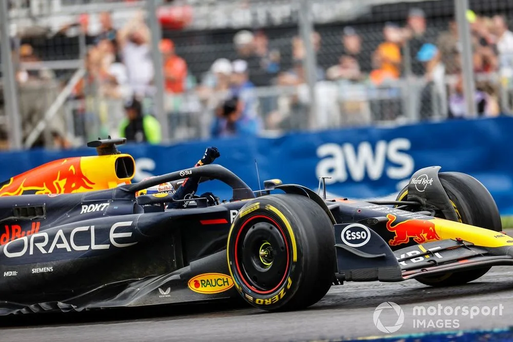 Max Verstappen, Red Bull Racing RB20, celebrates on track after winning the race