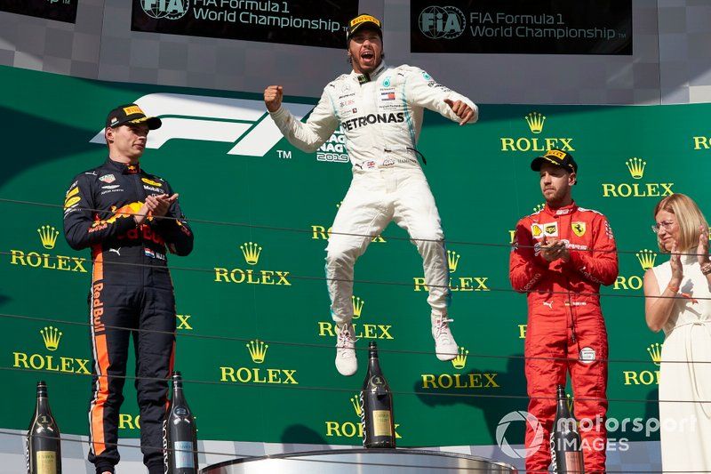Max Verstappen, Red Bull Racing, 2nd position, Lewis Hamilton, Mercedes AMG F1, 1st position, and Sebastian Vettel, Ferrari, 3rd position, celebrate on the podium