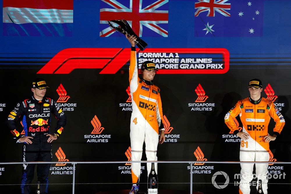 Max Verstappen, Red Bull Racing, 2nd position, Lando Norris, McLaren F1 Team, 1st position, and Oscar Piastri, McLaren F1 Team, 3rd position, on the podium