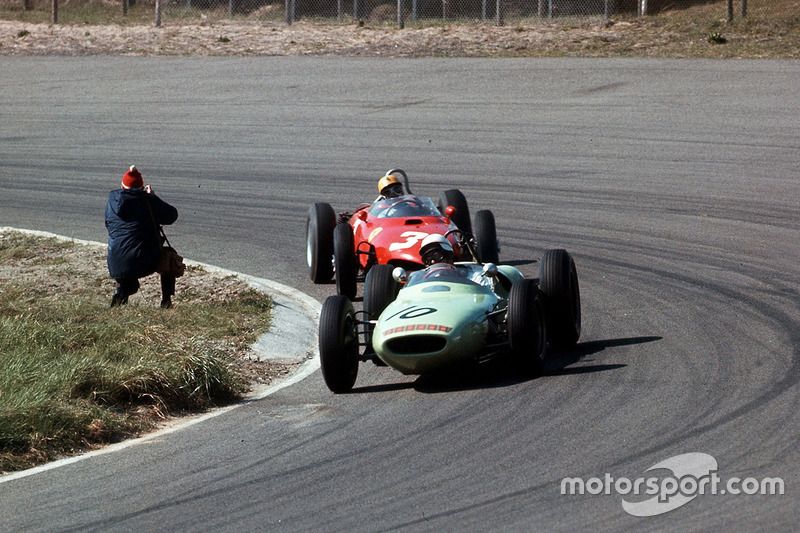 Masten Gregory, Lotus 18 Climax, leads Ricardo Rodriguez, Ferrari Dino 156